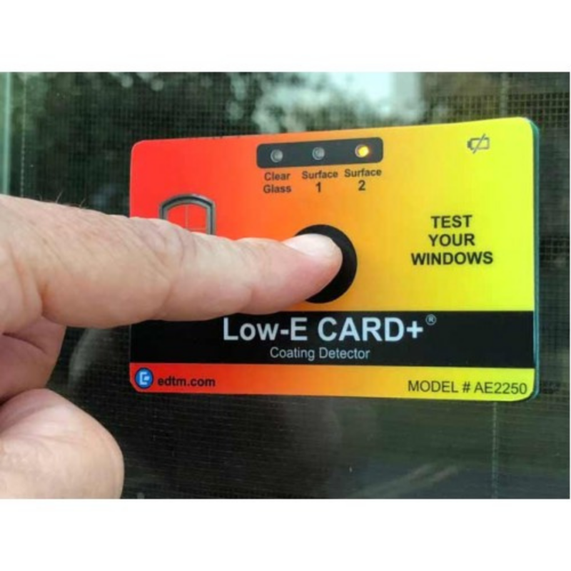 Photo of person holding a Low-E CARD+ meter up to a window to measure low-E on Express Window Films website